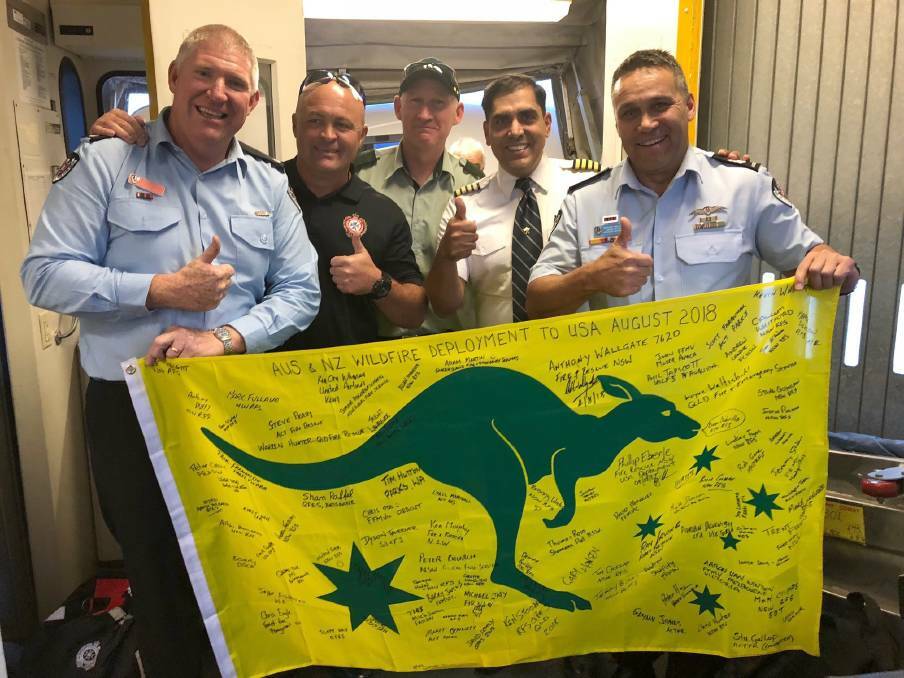 On a mission: Phil Eberle (far left) with other Australians on his recent journey to the US to tackle bushfires in that country.