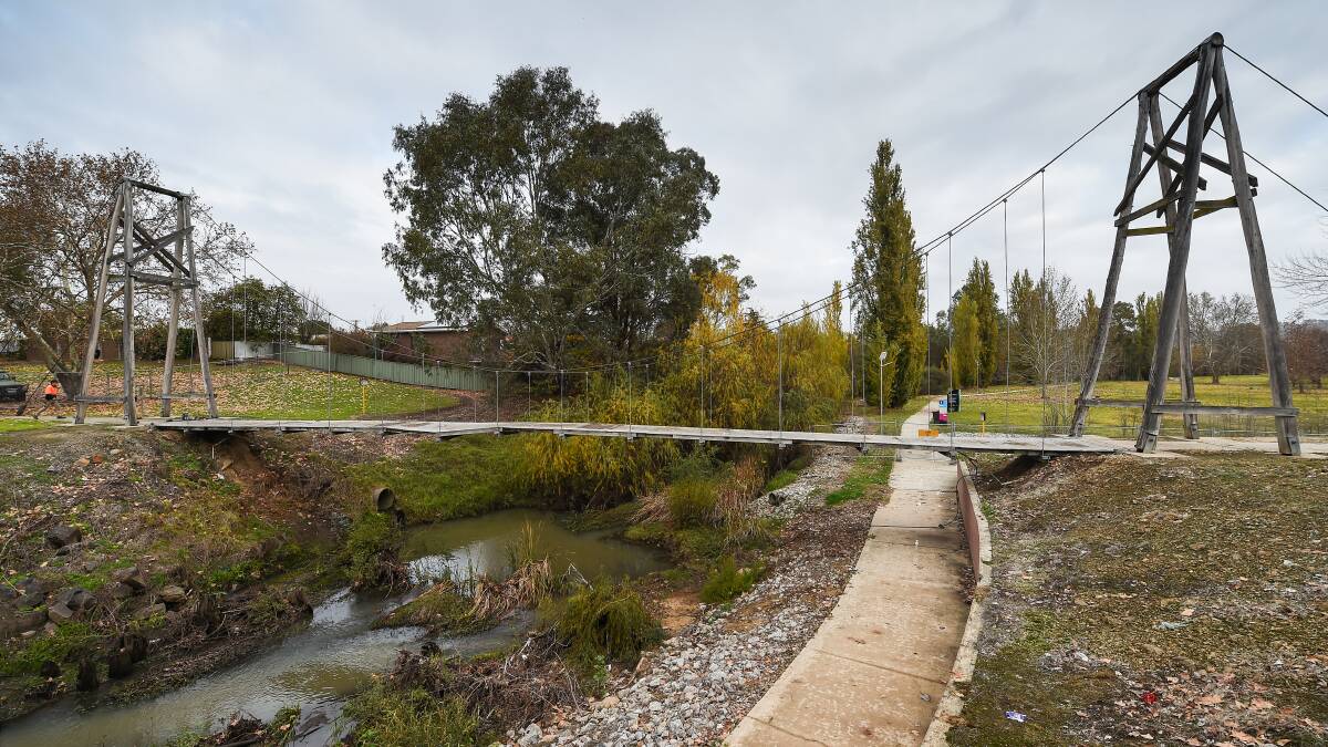 Going, going: The bridge over House Creek which was a landmark alongside Melbourne Road in Wodonga for decades. A footpath ran underneath it. 