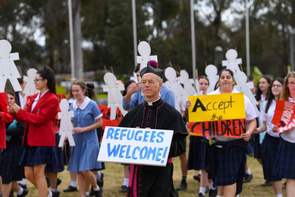 Taking a stand: Archdeacon Peter MacLeod-Miller joins students from Leeton's St Francis college outside Parliament House in Canberra on Tuesday. Picture: FAIRFAX
