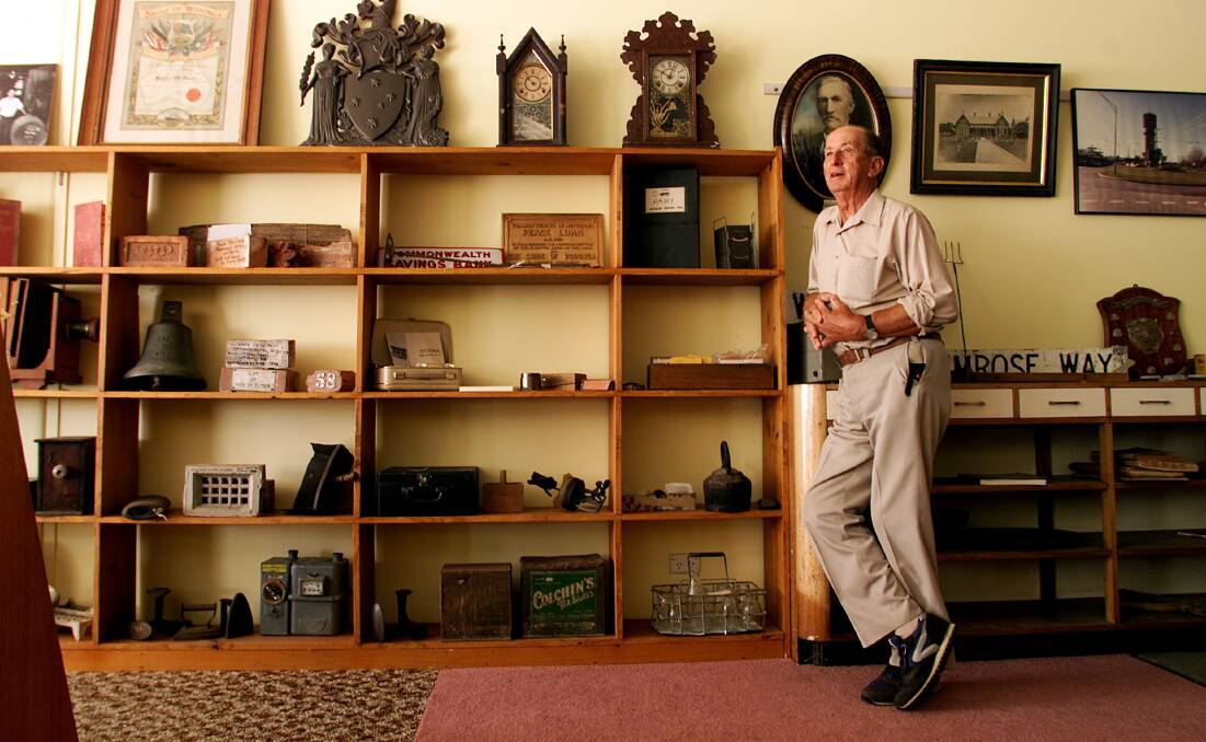 Walking encyclopaedia: Jim Parker pictured in 2002 with some of the Wodonga Historical Society's collection of artefacts. When he joined the city's show society he was its youngest member, being only 21.