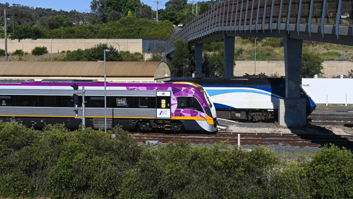 Side by side: The Victorian VLocity joins the NSW XPT at the southern end of the Albury railway station platform during a test run for the former model last week. Picture: MARK JESSER