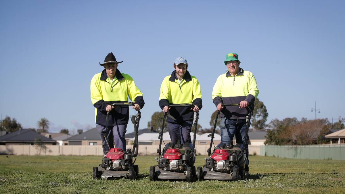 Mower men: James Church, Matt Christie and Phil Twycross are part of the Murray Valley Centre crew which does outdoor work across Wodonga. 