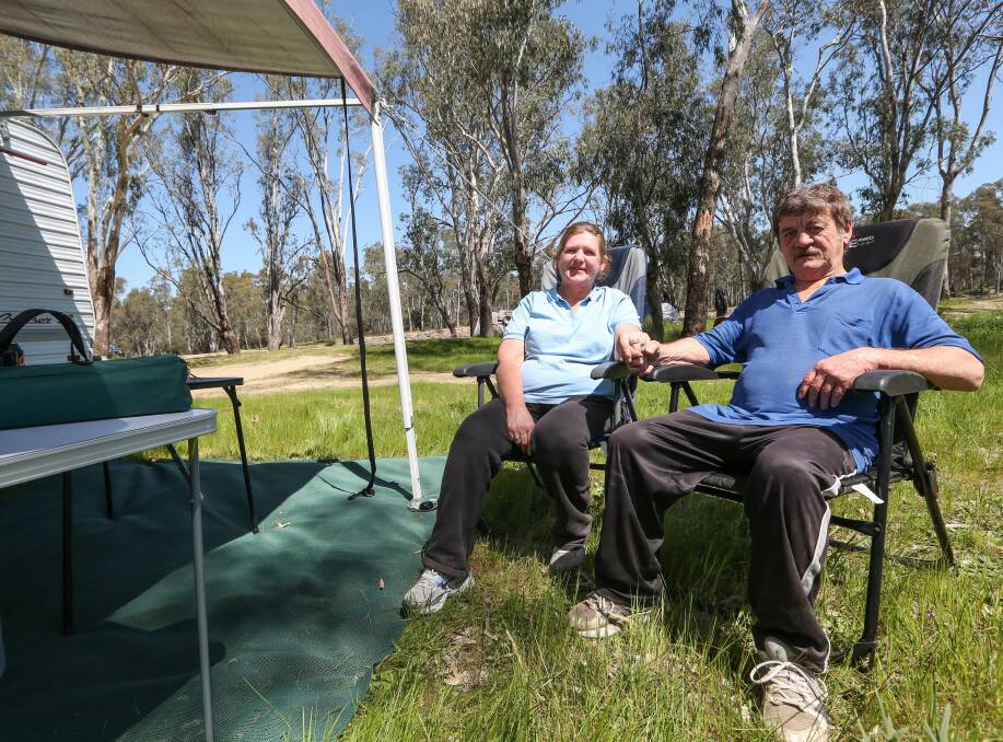 How's the serenity?: Melbourne couple Deborah and Brian Geary decided to take advantage of the grand final holiday and camp at Wahgunyah. Picture: JAMES WILTSHIRE 
