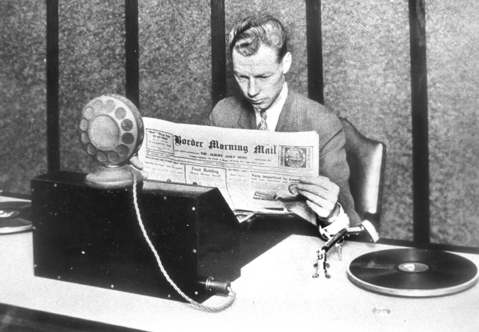 Crucial voice: ABC radio Arthur Newnham at the microphone in the studio set up in the Albury post office. 