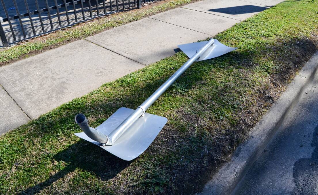 Struck down: A road sign knocked over in Barlow Street, Lavington, by a reckless driver.
