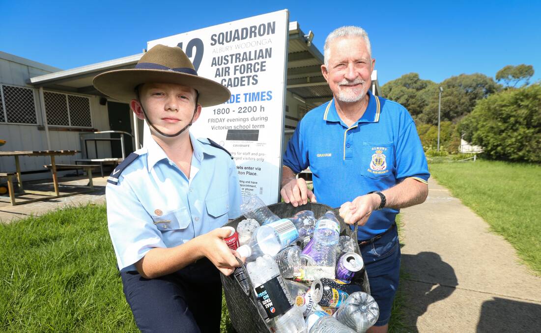 Worth drinking to: Air force cadet James McCarthy and Albury RSL sub-branch president Graham Docksey mark the end of his fundraising through gathering drink containers. Picture: JAMES WILTSHIRE