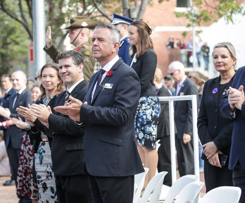 VIPs: Albury MP Justin Clancy, council general manager Frank Zaknich, acting mayor Amanda Cohn (on dais) and Farrer MP Sussan Ley watch the Anzac march.