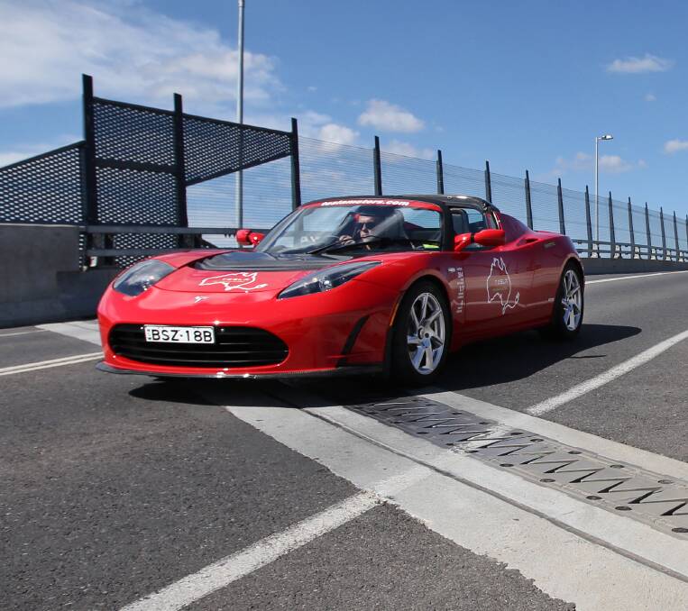 Zapping along: A Tesla car crosses the Hume Freeway in Albury. Such cars can now be recharged in Wodonga.