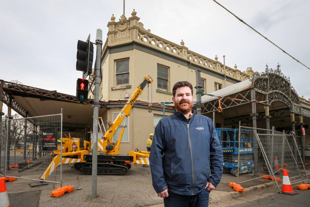 Work underway: Sodens publican Brendan Tracey finally saw activity begin on Friday to repair his damaged verandah. The crane was needed to lift columns into place. Picture: JAMES WILTSHIRE