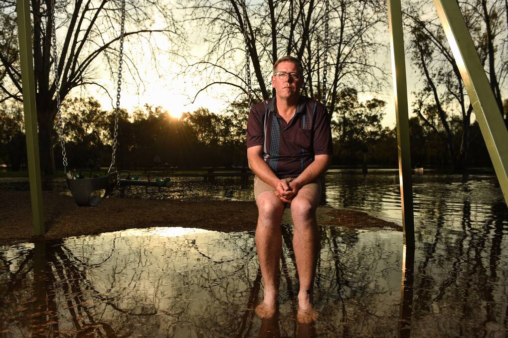 THEN: Darryl Coventry in what was a severely flooded Noreuil Park in 2016. Picture: MARK JESSER