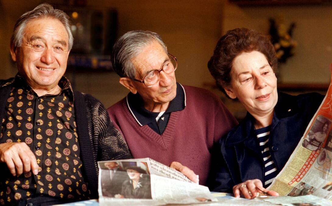 Flashback: LIndsay Poy with his brother Roy and niece Carmen Hood looking at newspaper articles in 1999 about the appointment of his niece Adrienne Clarkson to the position of governor-general of Canada.
