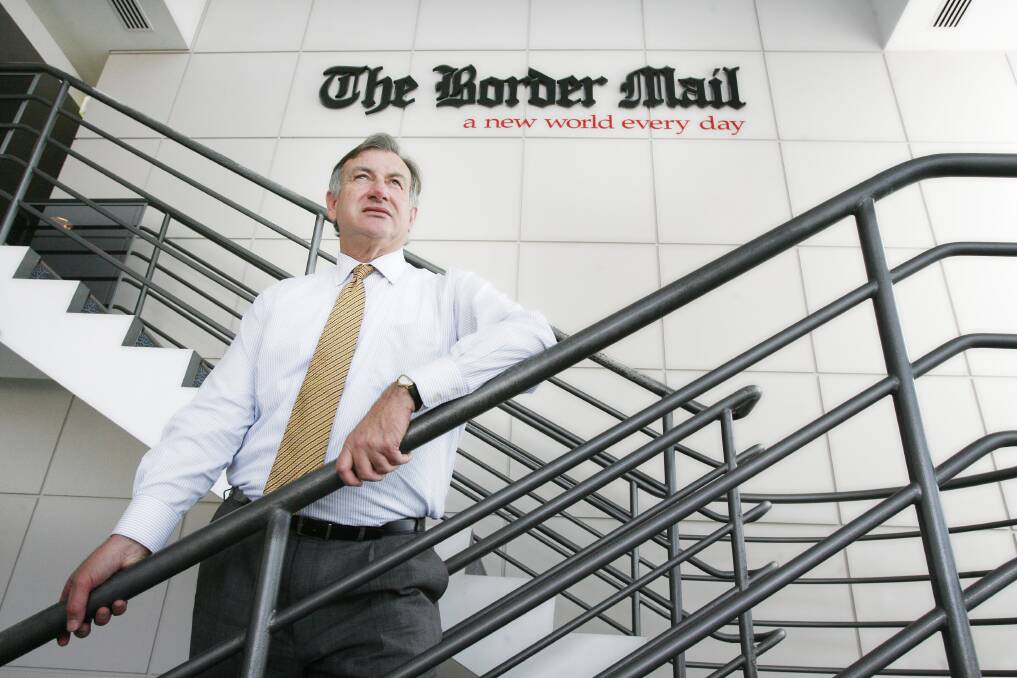 Giant presence: Tony Whiting pictured in 2008, at the time of his departure from the daily newspaper. He was in the atrium of the Wodonga building into which editorial, advertising and production staff moved in 1999. 