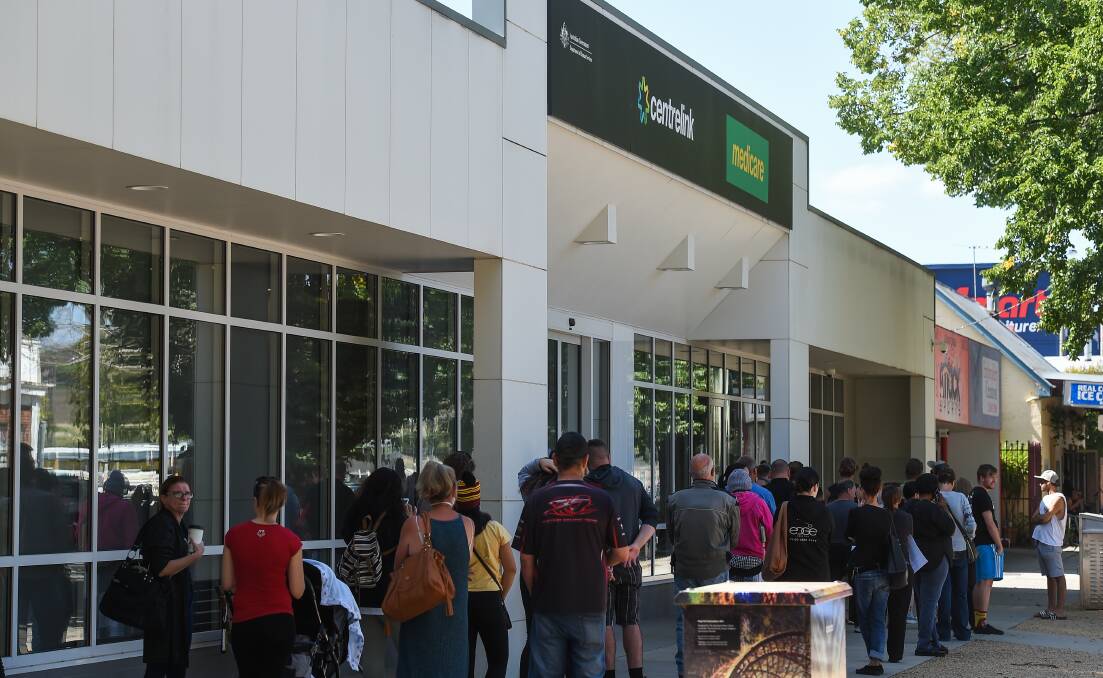 Reflective: Queues outside Albury's Centrelink office in March showed the impact of the coronavirus shutdown on employment.
