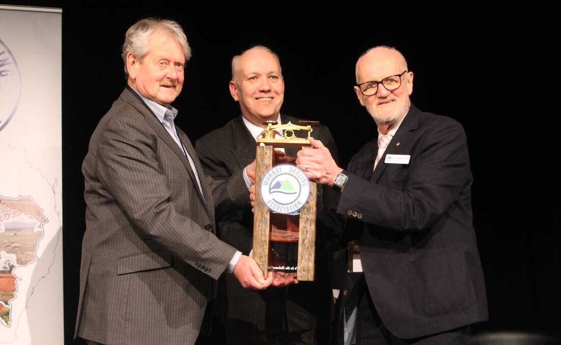 Murray Bridge mayor Brenton Lewis accepts a trophy for hosting the conference from Murray Darling Association chief executive Mark Lamb and president David Thurley. Picture from Murray Darling Association