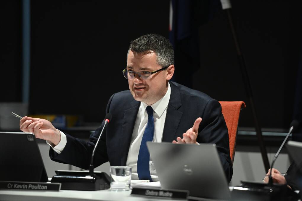 Wodonga mayor Kev Poulton is keeping his hand down when it comes to telling ratepayers whether he will put his hand up to remain as the city's leader.