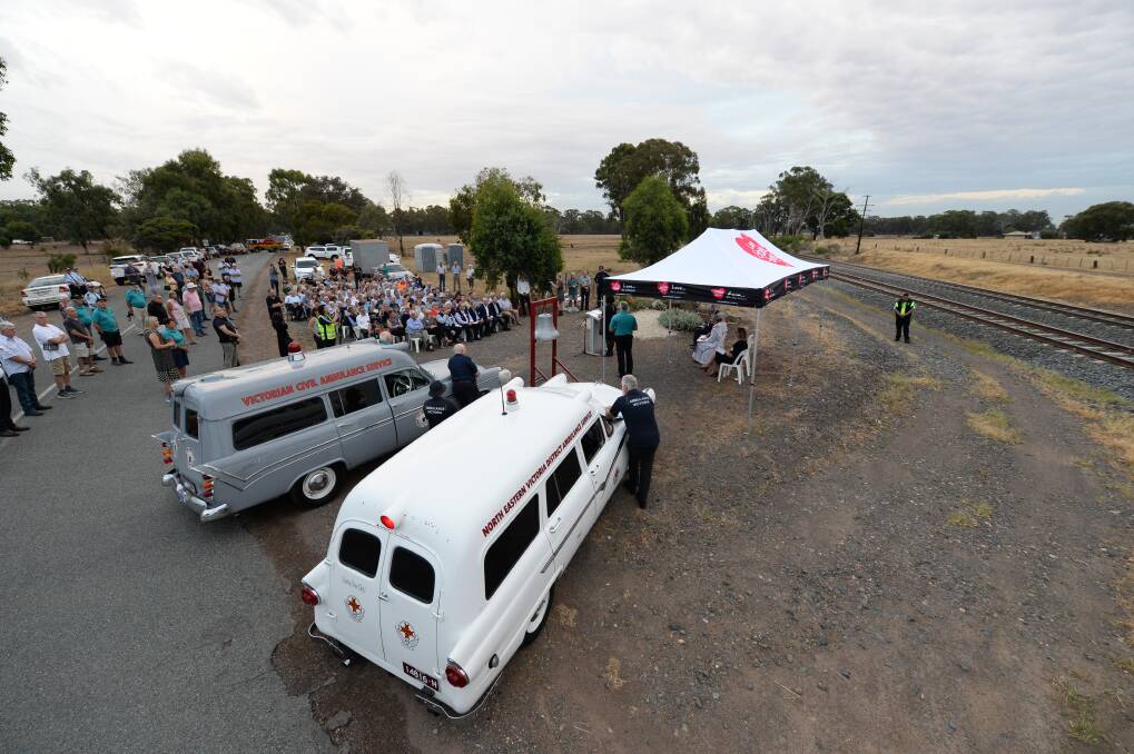 Special moment: Ambulances used in the 1960s were parked alongside a memorial stone as Violet Town marked the 50th anniversary of the Southern Aurora tragedy at the crossing where it occurred in 1969. Picture: MARK JESSER
