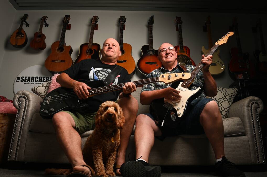 Musical mates: Mick Sharp and Les Brazil with dog Harper at the latter's home at Yarrawonga where their COVID song was recorded. Picture: MARK JESSER