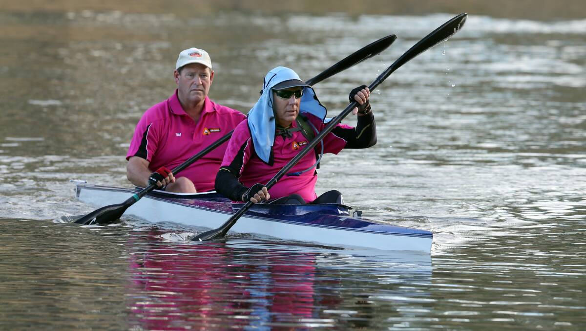 Paddling on: Peter Walsh pictured with Nationals colleague Tim McCurdy during a Murray River canoeing marathon. He will remain at the helm of his party after a leadership vote on Monday.