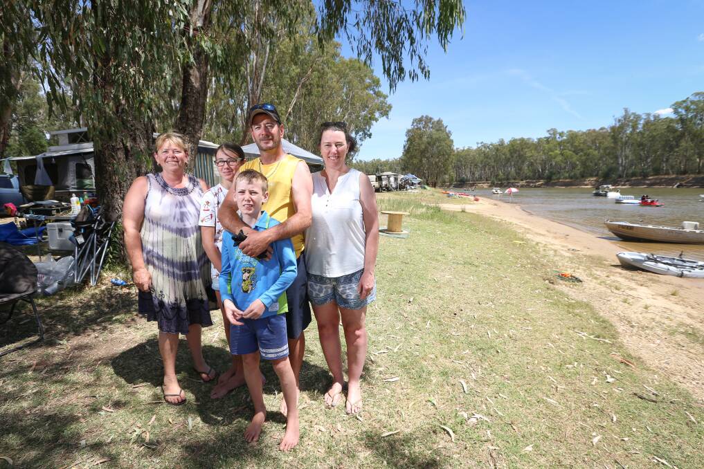 Camping close to home: Barooga residents Tracey Watt and the Franklin family, husband Ron, wife Mel and their children Heidi, 12, and Xavier, 10, have enjoyed staying in their town's environs at Quicks Beach on the Murray River. Pictures: JAMES WILTSHIRE