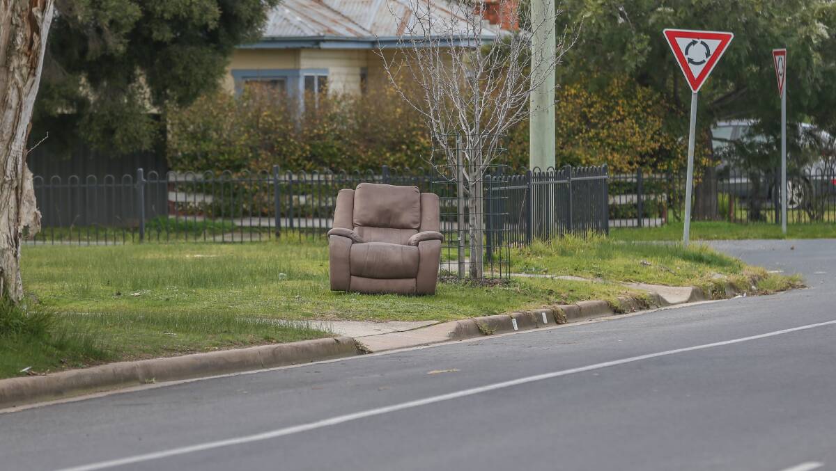 Forlorn: A lounge seat on a nature strip on McDonald Road, Lavington yesterday. Picture: TARA TREWHELLA