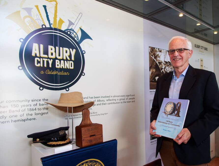 Note maker: Greg Ryan with his history of the Albury City Band, which was launched at the Library-Museum on Monday. Picture: SIMON BAYLISS 