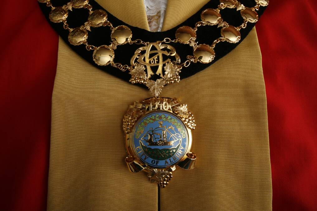 Historic symbols: The mayoral robe and chain of Albury which feature the city's traditional emblem of a paddle steamer.