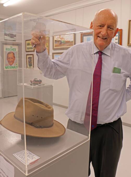 Life on show: Tim Fischer with one of his hats that has been encased at the gallery opened in May at Lockhart to display his artefacts. Picture: NARRANDERA ARGUS