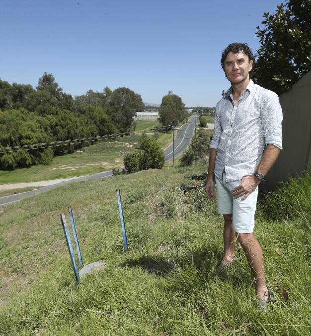 Zone of contention: Mark Norden with Willowbank Road land in the background which is subject to an application to classify it industrial. Picture: ELENOR TEDENBORG