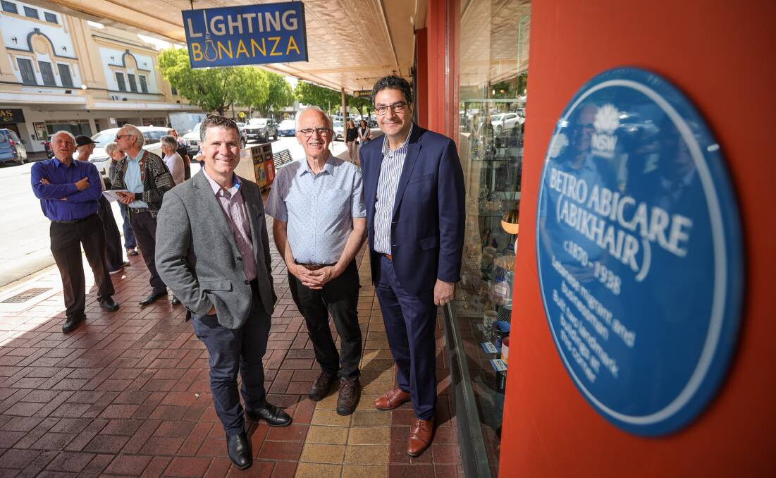 Justin Clancy, Greg Ryan and Tim Farrah with the plaque saluting Betro Abicare which is on the corner of the Australian Building which once housed The Big Store. Picture by James Wiltshire.