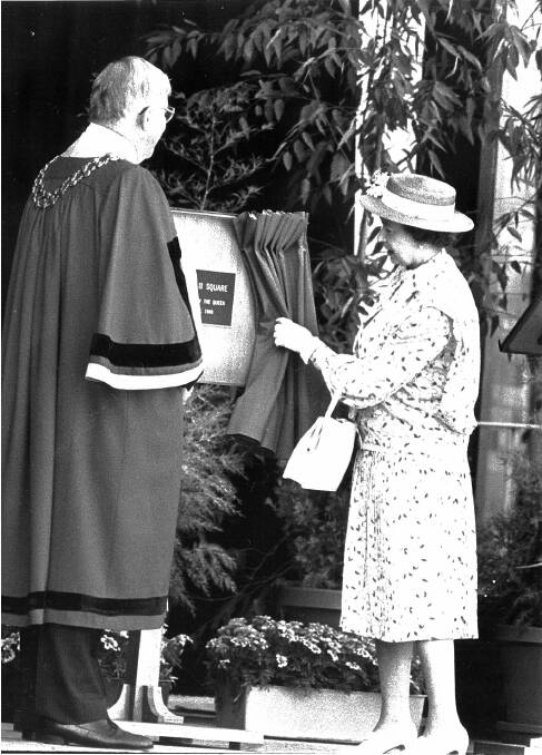 Flashback: Then Albury mayor John Roach watches the Queen unveil a plaque for the newly named QEII Square in 1988. They were on the steps of the entertainment centre. Mystery surrounds the whereabouts of the plaque now.