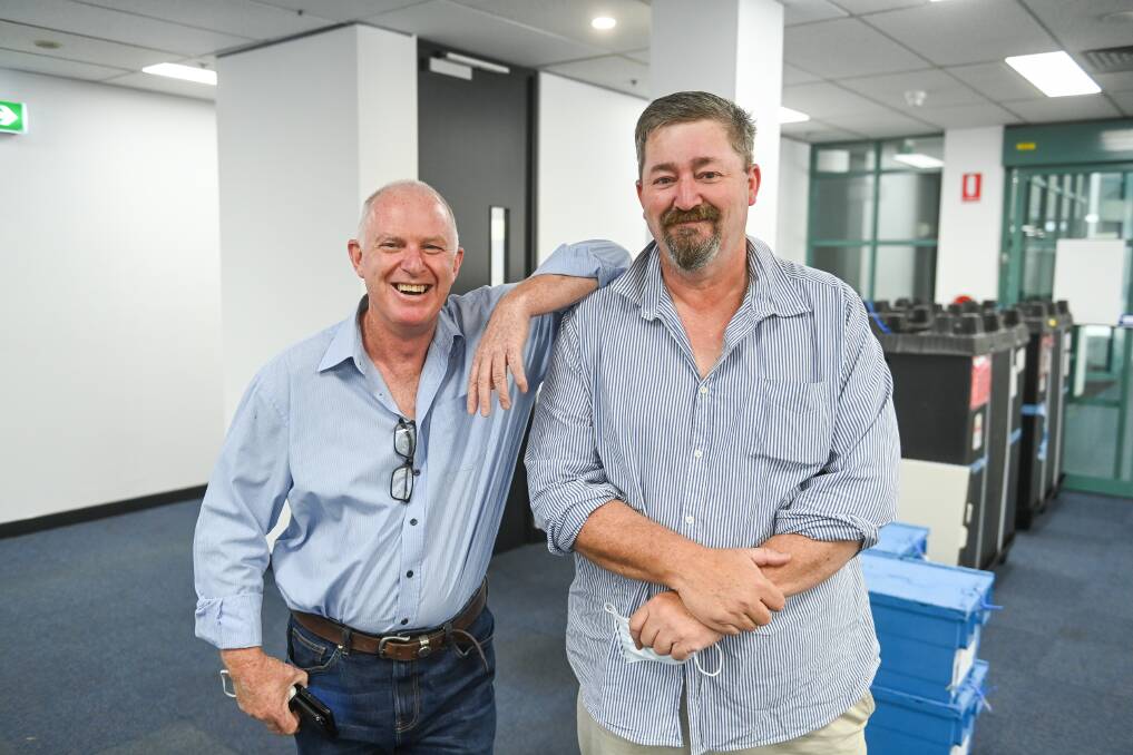 Winners: Daryl Betteridge and Darren Cameron in the former tax office in Albury's Smollett Street after being officially elected. Picture: MARK JESSER