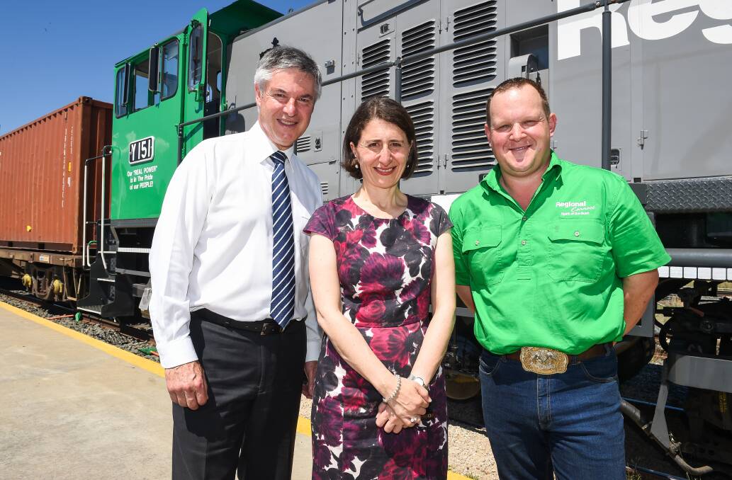 On track: Member for Albury Greg Aplin, NSW premier Gladys Berejiklian and Ettamogah Rail Hub chief operating officer Cameron Jackson at the freight centre north of Albury. Picture: MARK JESSER 
