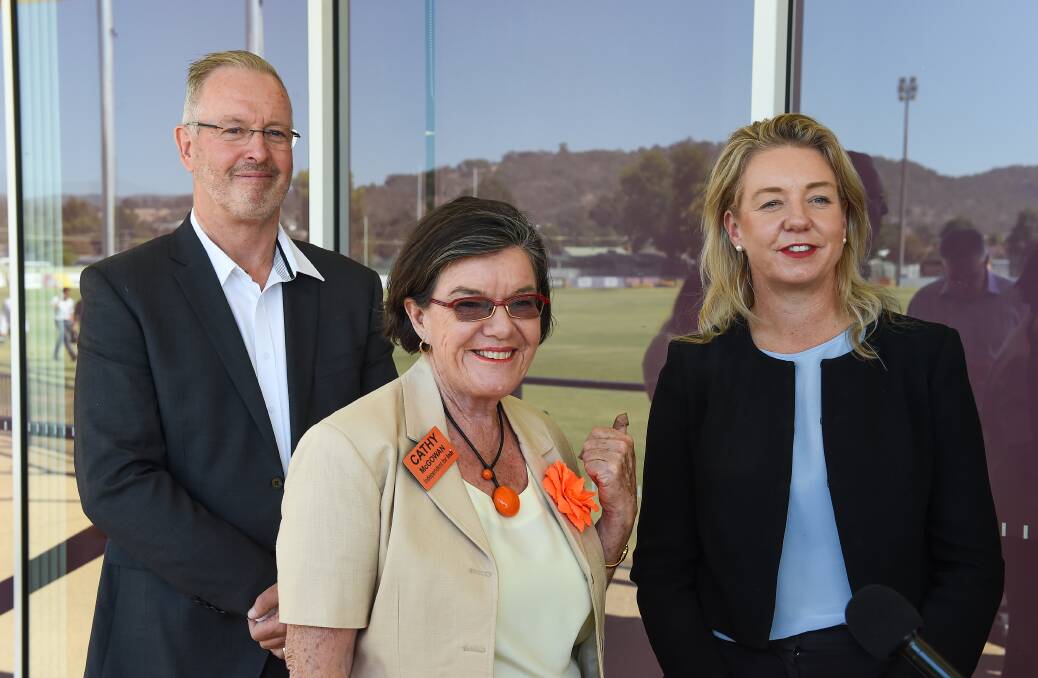 Orange and green: Then Indi MP Cathy McGowan with Nationals candidate Mark Byatt and Nationals Senator Bridget McKenzie during last year's election campaign when a funding announcement was made at Wodonga's Martin Park.