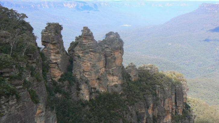 Landmark: The Three Sisters in the Blue Mountains west of Sydney. A reader says the range helps shape a divide between urban and rural Australia. Picture: JULIA WHYTE