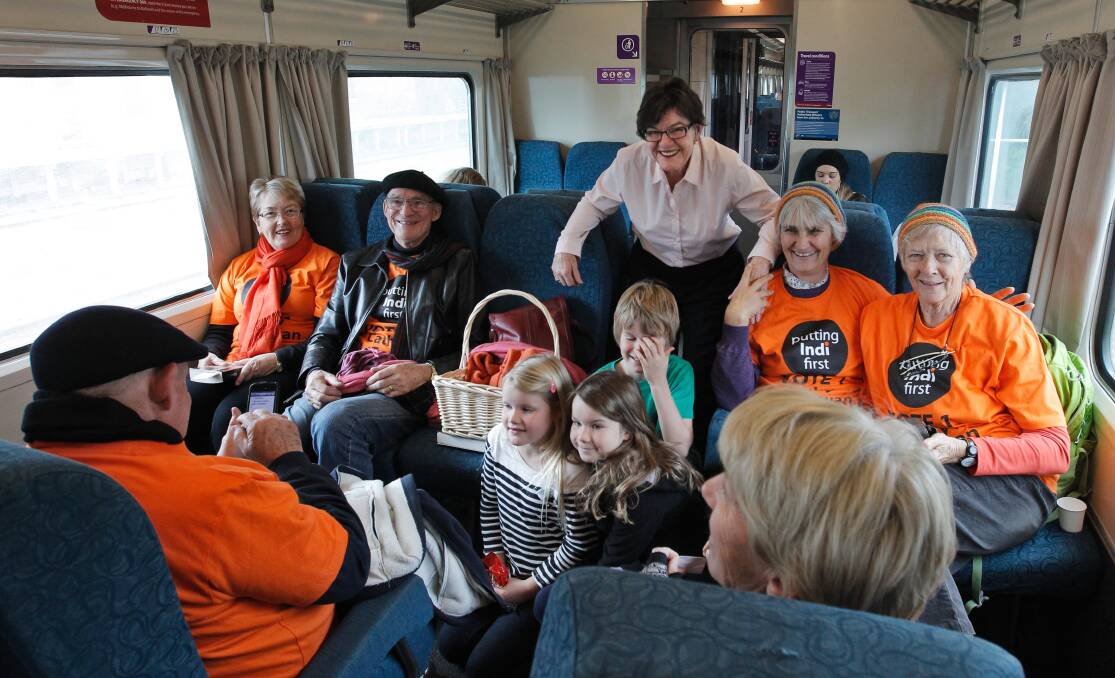 Flashback: Cathy McGowan and supporters aboard a V/Line train during her first election campaign in 2013 which saw her voted in as member for Indi.