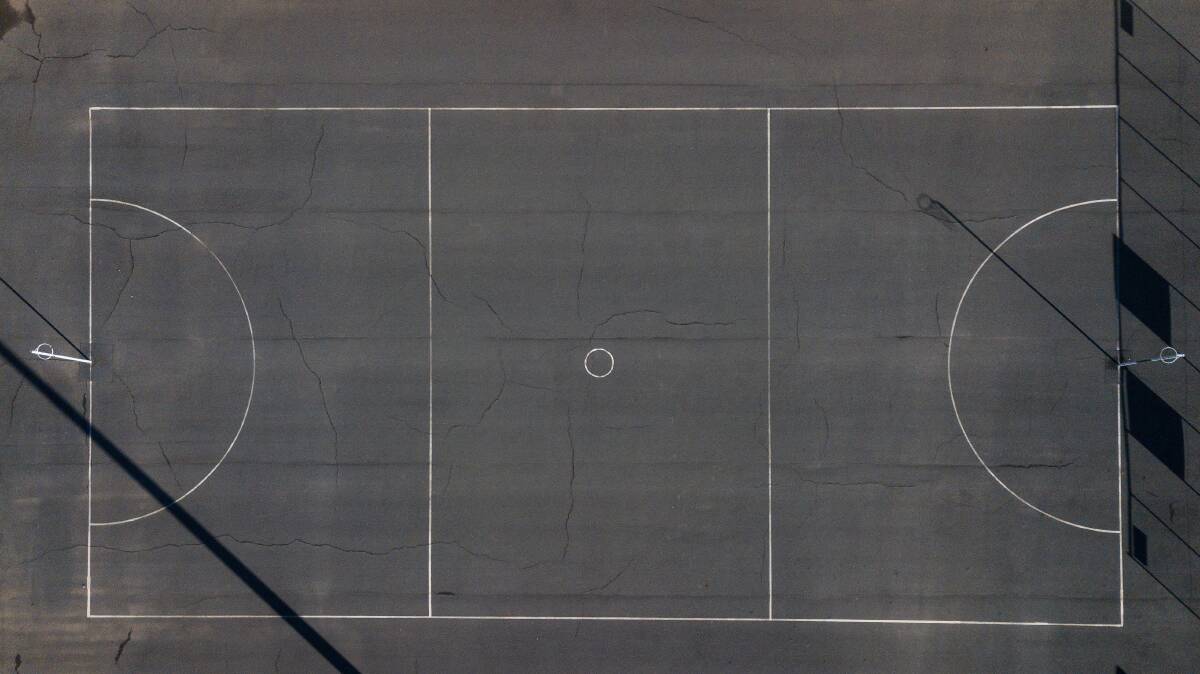 Extra line markings: Aerial view shows cracks that have splintered in different parts of the netball court used by Wodonga Bulldogs and Saints at Martin Park.