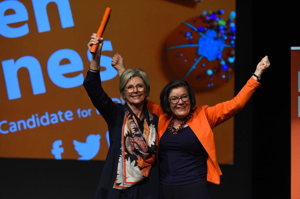 Indi-pendents: Helen Haines holds a baton passed on to her by Cathy McGowan at her campaign launch in Wodonga last month. Picture: MARK JESSER