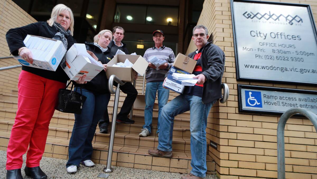 Flashback: High Street traders deliver petitions to Wodonga Council in 2013 protesting against the proposed closure of Hovell Street.