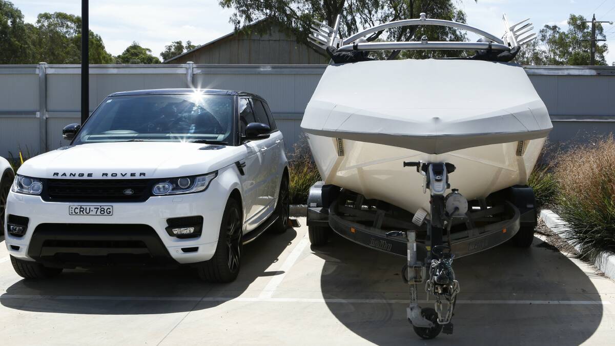 Part of the haul: A Range Rover and boat found as part of raids by police at Echuca on Friday morning. Picture: RIVERINE HERALD