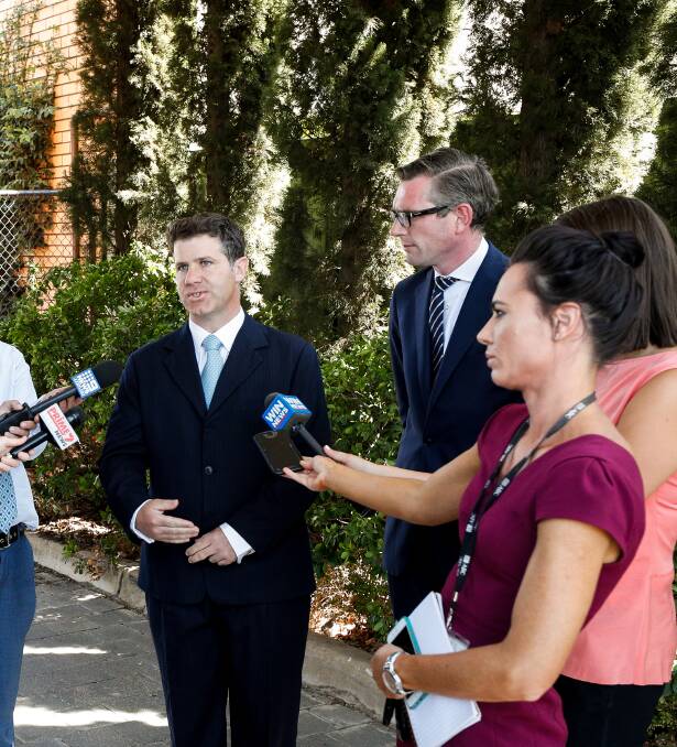 Flashback: Justin Clancy speaks to the media as Domenic Perrottet watches on during a visit to Albury in 2019 ahead of the NSW election that year.