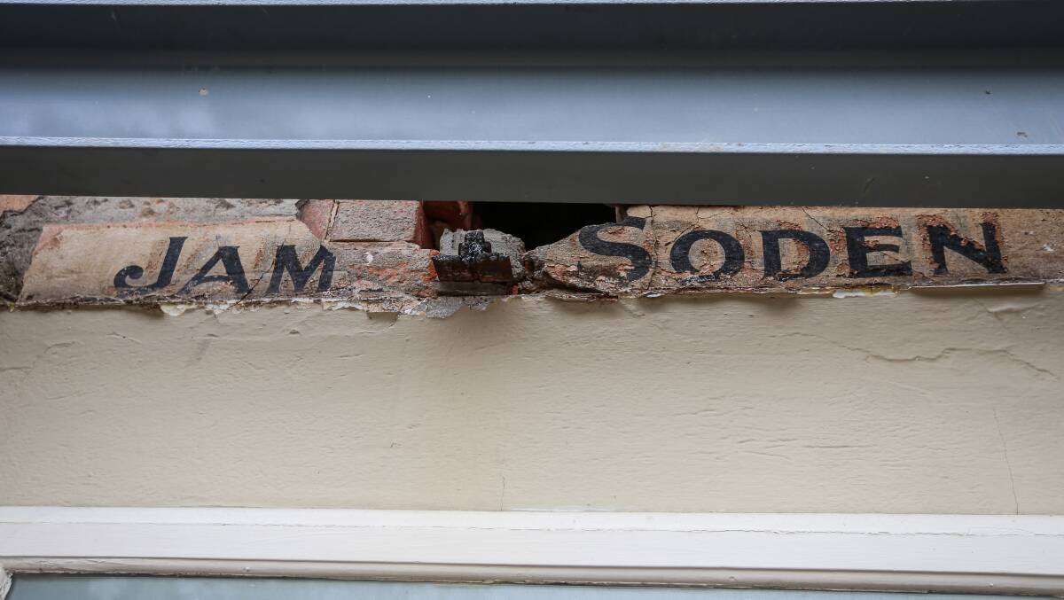 History uncovered: A sign bearing the name of original licensee James Soden was uncovered when paintwork was torn away by the crash last November. It will now be covered again but a replica is expected to adorn the hotel after the verandah restoration. Picture: JAMES WILTSHIRE