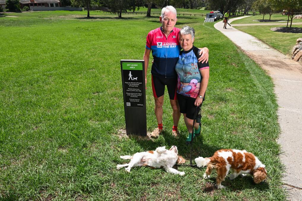 Not suitable: Craig and Jenny Sutter with their pets Daisy and Sophie in an area of Willow Park earmarked for a dog park. They believe the terrain and surrounds make it a poor choice. Picture: MARK JESSER
