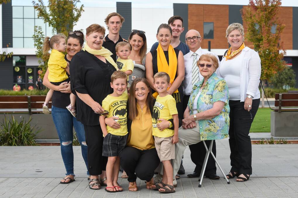 Team yellow: Jacqui Hawkins (front) with nephews Kenji Buckley and Brock Gosden (both aged 5) and her mother, sisters and grandmother and family and friends at the launch of her candidacy for Benambra. Picture: MARK JESSER