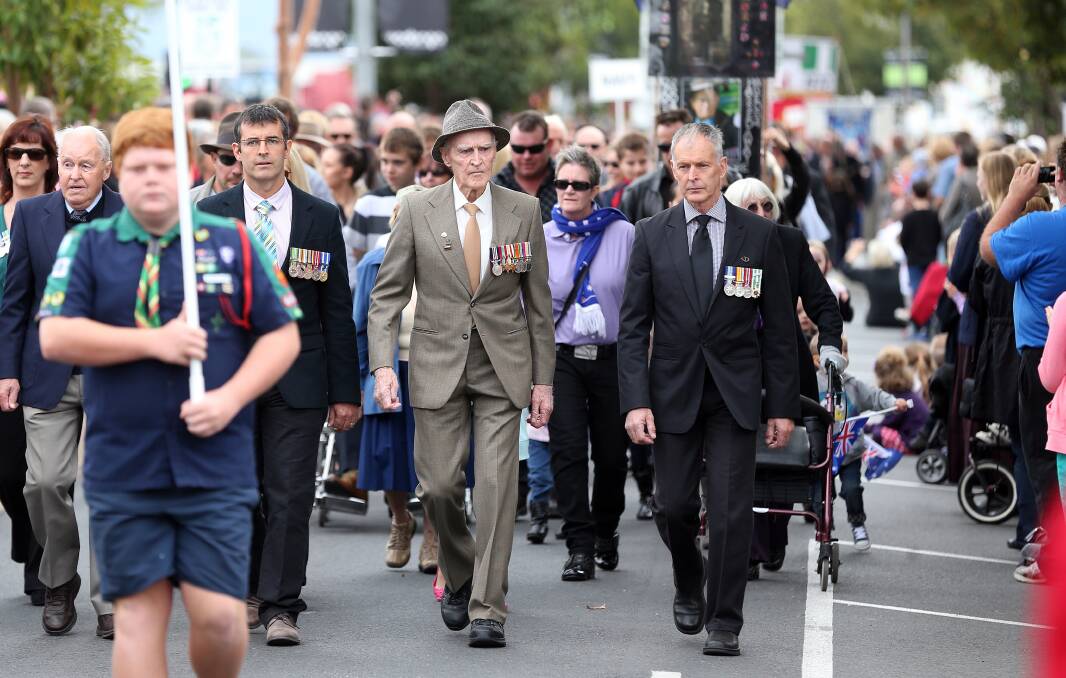 Flashback: Jim Mooney, with his hat on, marches along Wodonga's High Street during the Anzac Day parade in 2013.