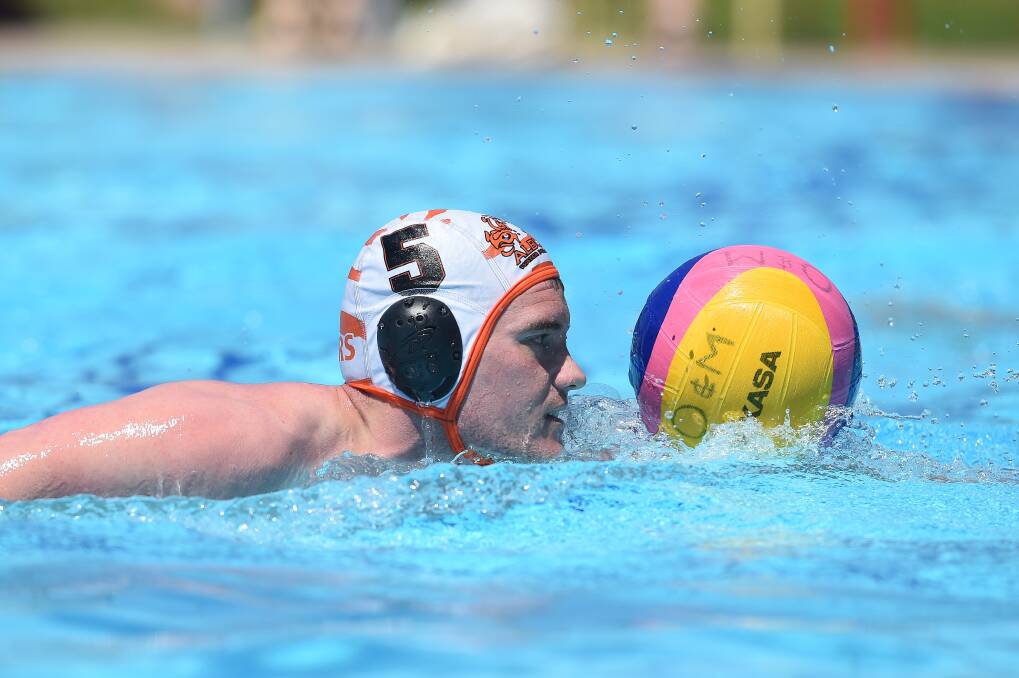 In action: Jack Baker swims the ball up during the opening round of the O&M water polo competition at Wodonga's WAVES at the weekend.