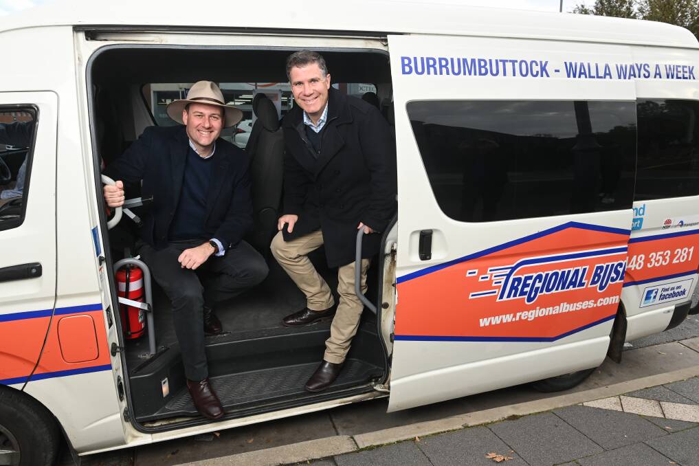 On board: Regional Transport Minister Sam Farraway and Albury MP Justin Clancy check out one of the buses that serve southern Riverina towns. Picture: MARK JESSER