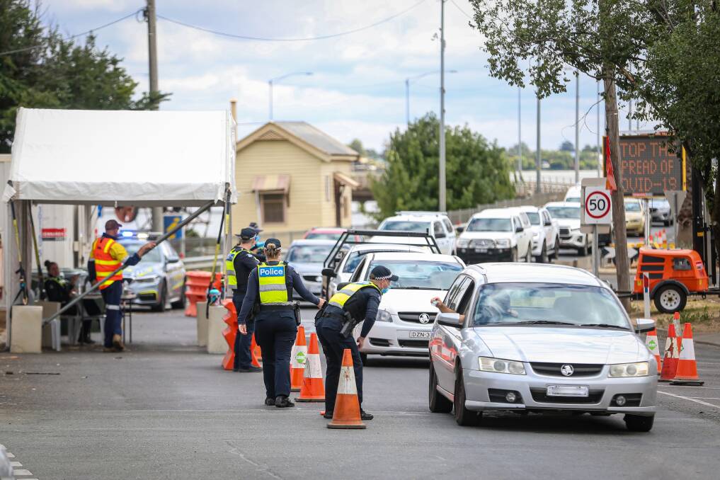 Flashback: Checkpoints, like this one at Yarrawonga in Victoria in January, cruelled the NSW tourism sector in places such as Mulwala.