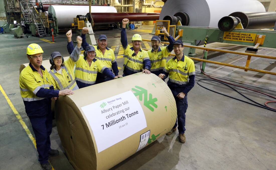 Hooray: Norske Skog crew members Simon Ayers, Julie Garoni, Graham Scott, Paul Lee, Hayden Burles, John Mullavey and Brad Boots celebrate the seven millionth tonne of paper produced in 2015. 