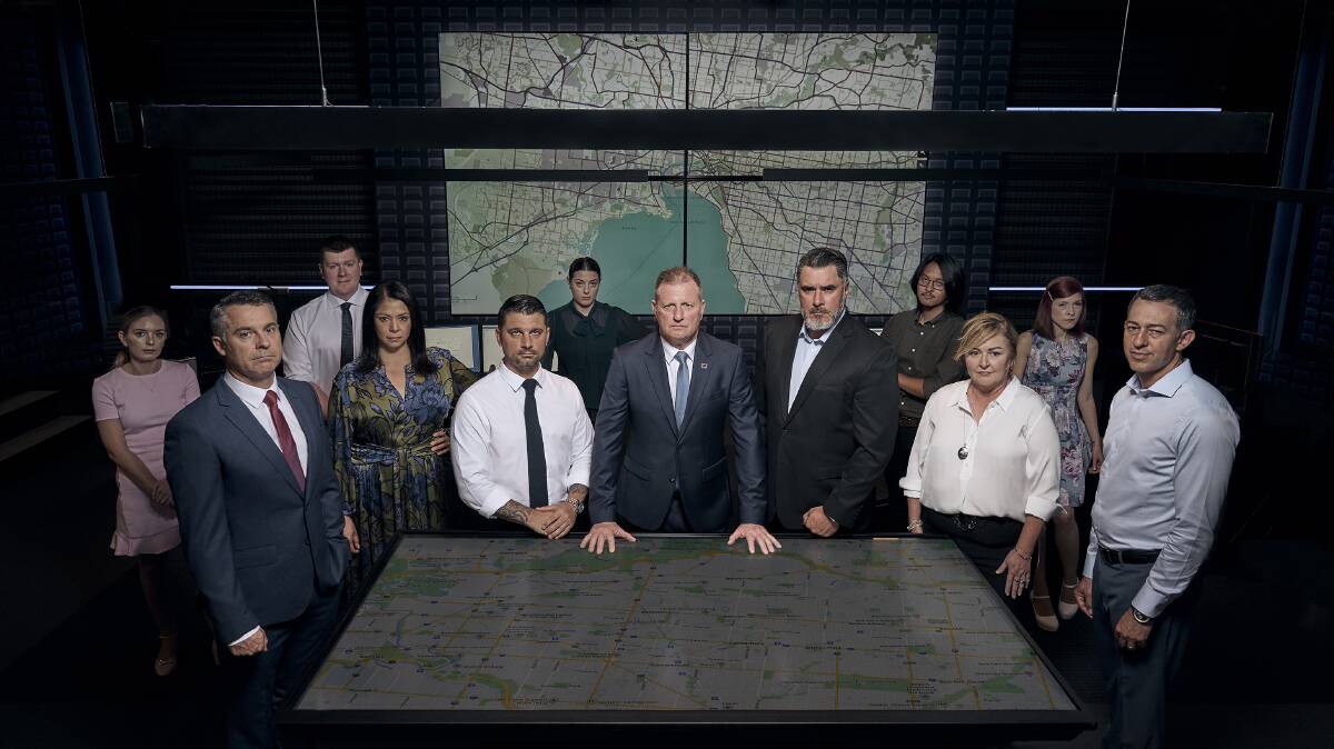 Ratings rocket: Graeme Simpfendorfer (at table on the left) with his fellow investigators in the television show Hunted. Picture: NETWORK 10