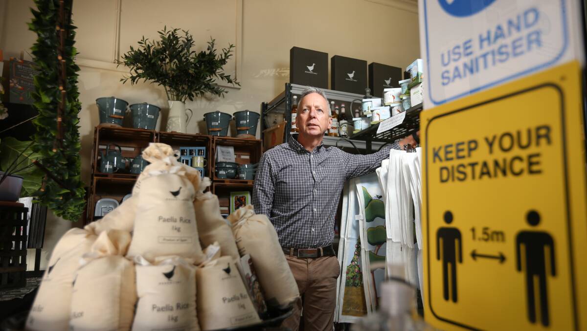 Proven product: Barry Young at his Albury shop The Essential Ingredient in Dean Street. He has embraced a decision to extend funding for the city's peak business group which he leads.
